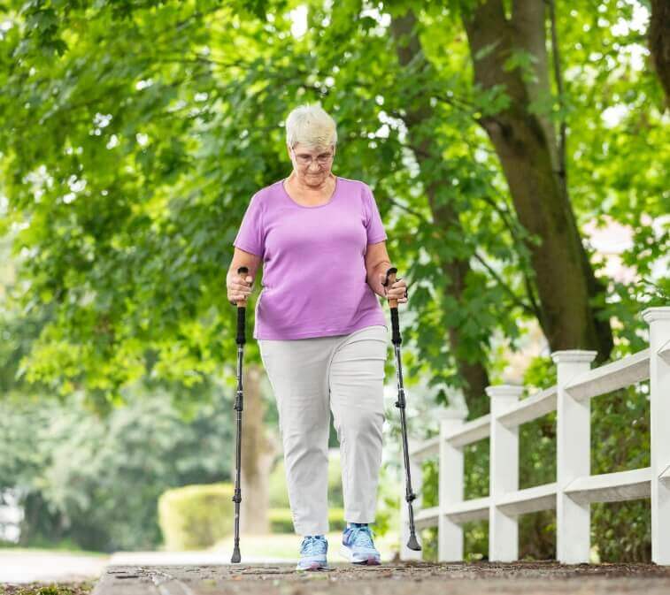 Picture of Woman walking with support sticks