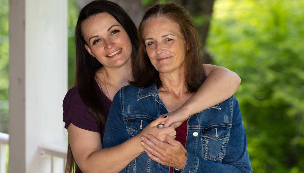 Maria and her daughter Kelly embracing