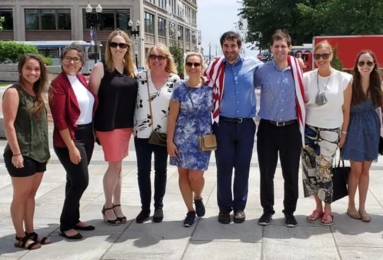 Group photo of Amylyx team smiling outdoors standing together